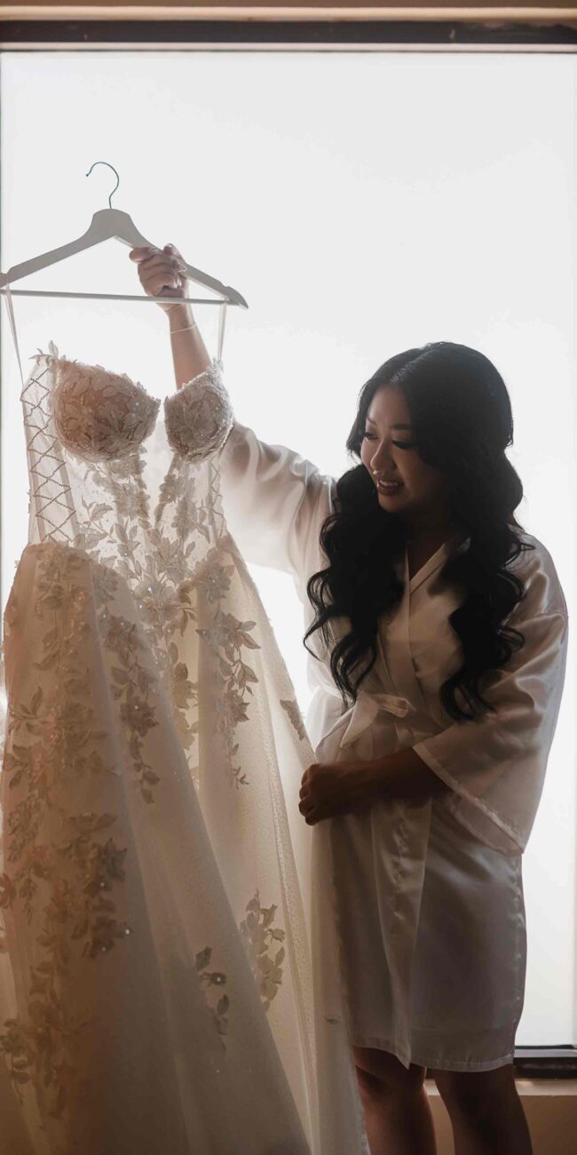 bride is looking at her dress