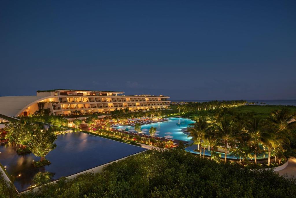 Aerial nighttime view of The Riviera Maya EDITION at Kanai beachfront luxury wedding resort