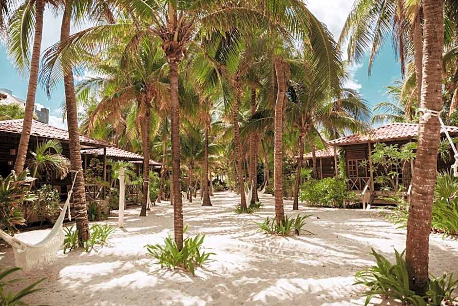 Tropical boutique hotel grounds at Petit Lafitte for intimate weddings in Riviera Maya