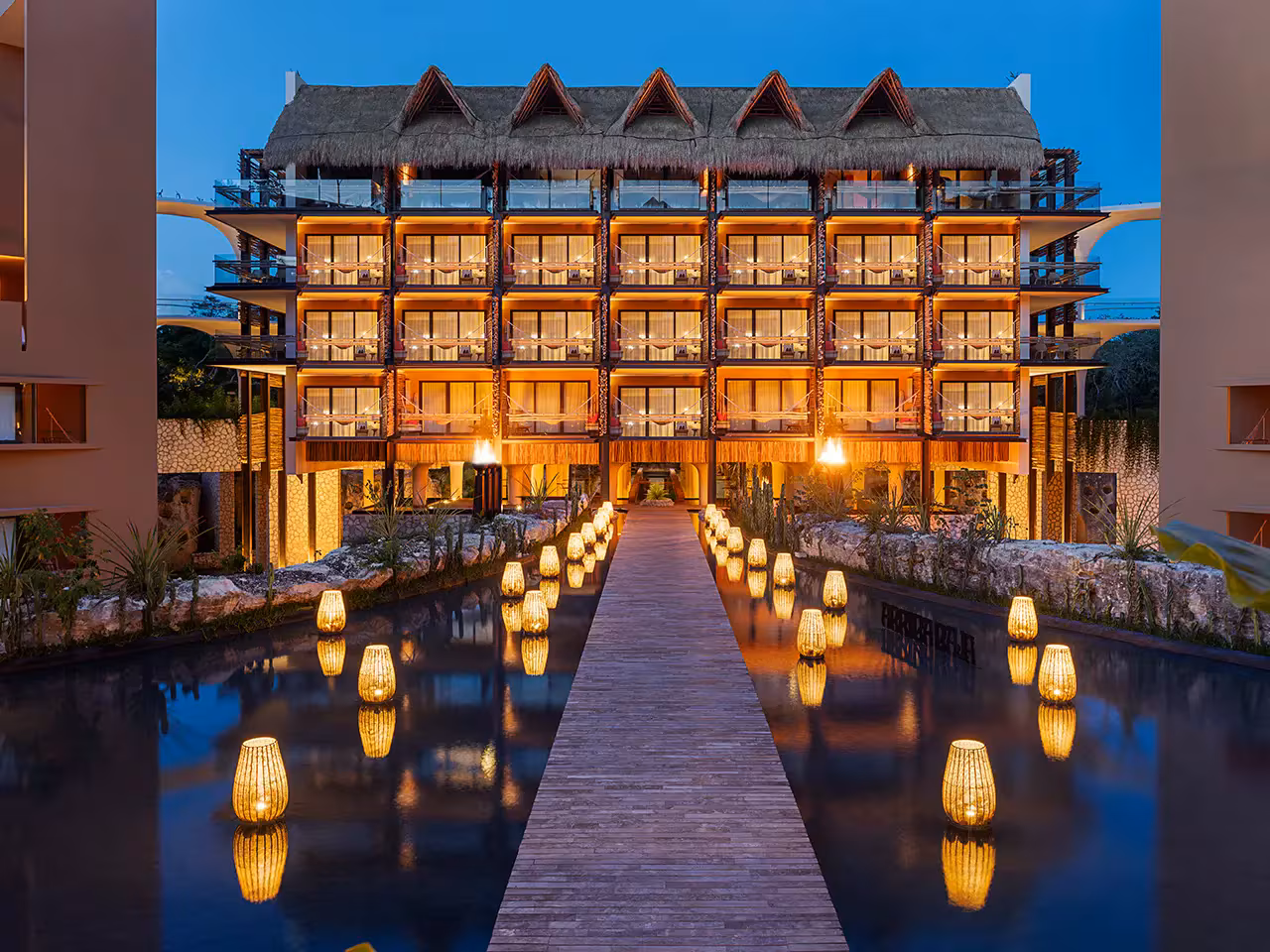 Luxury waterfront architecture at Hotel Xcaret Mexico for destination weddings in Playa del Carmen